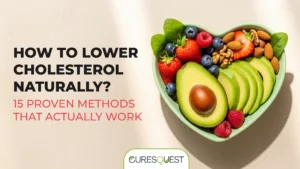 A bowl in the shape of a heart holds a variety of healthy foods, including sliced avocado, strawberries, blueberries, raspberries, walnuts, and almonds. The background is a light, neutral color. On the left side of the image, the text "HOW TO LOWER CHOLESTEROL NATURALLY?" is written in a large, bold font, with the words "15 PROVEN METHODS THAT ACTUALLY WORK" below it in a smaller font. The bottom of the image features the logo for Curesquest.